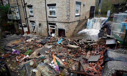 Storm Angus floodwater inundates homes in Manchester – video report
