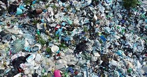 Plastic in the mountains, Mountain garbage, large garbage pile, degraded garbage. Pile of stink and toxic residue. These garbage come from urban areas, industrial areas. Consumer society Cause massive