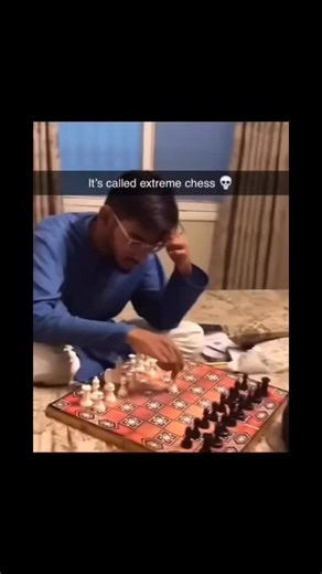 @goofyymemess on Instagram: "The 8-second post captures a high-octane subversion of the world's most intellectual game, humorously dubbed "extreme chess." The footage depicts two players abandoning turn-based etiquette for a frantic, simultaneous free-for-all. Hands blur across the board as pieces are slammed down in a chaotic race to the king, transforming a quiet game of strategy into a high-speed physical scramble that emphasizes reflexes over rank-and-file logic. Amassing 5.8M views and 920k
