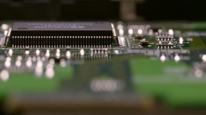 Tracking along the edge of a processing chip on a circuit board Free Stock Video Footage