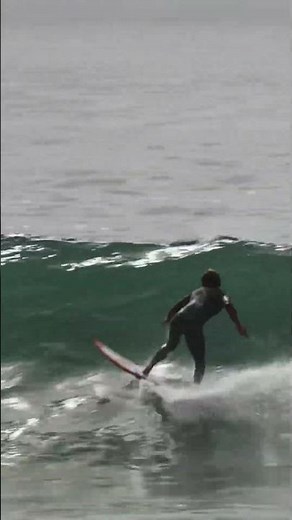 Surfers Ride the Waves with Passion and Skill