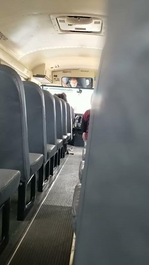 Crazy bus driver flips out on kid and throws hands off wheel