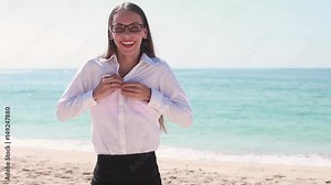 woman taking off clothes on a beach