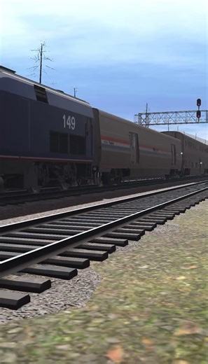 Amtrak P42 passes a BNSF ES44AC at a red signal