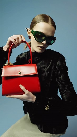 The Deville Bag. The shape of the season, a ladylike top handle. Prim and precise lines draw attention to cabochon button clasps. #ToryBurchFW23 #ToryBurch | TORY BURCH