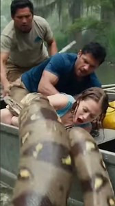 A horrifying moment as a python lunges out and drags a woman underwater!