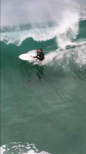 WAVE BODY-SLAMS SURFER ONTO SAND