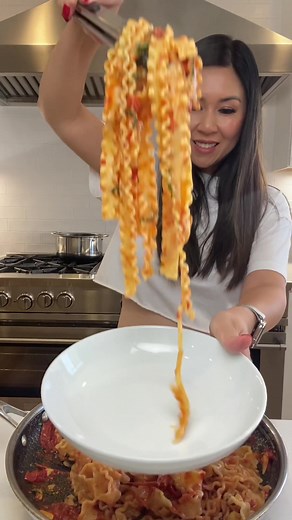 Save this recipe for Pasta Sauce! It’s one of the first real recipes I attempted making when I started to learn how to cook for myself. Start with a generous amount of olive oil, sliced garlic and chili flakes. Cook on low heat so the garlic and chilis infuse the oil with flavor, but won’t burn. Then add in jarred or canned tomatoes (San Marzano are the best in my opinion), salt, pepper and simmer on medium high heat until the tomatoes soften and you can squash them. Lastly add chopped basil and