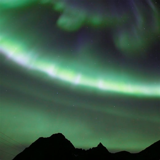 Look at those purple and blueish auroras dancing over the mountain | Aurora Borealis Observatory