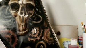 Painting a killer design over stock tribal graphic on a guitar