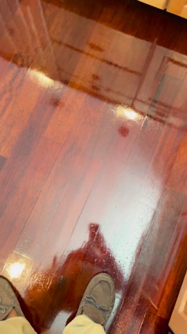 How to remove air bubbles from polyurethane coat on hardwood floor?
