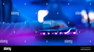 Professional cyber video gamer studio room with personal computer armchair, keyboard for stream in neon color blur background Stock Photo - Alamy