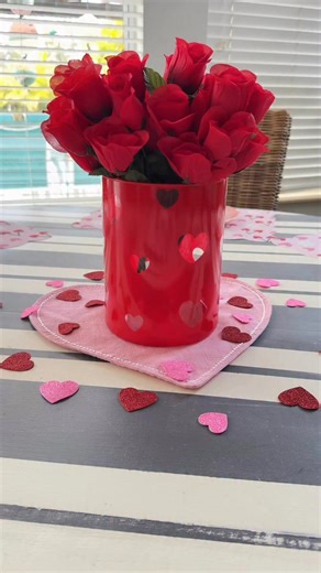 Laura Jeanne on Instagram: "Easy Valentine centerpiece! ❤️ I purchased my heart stickers off Amazon. *tip.. I prefer to use the foam heart stickers as they are slightly raised, making it easier to grab and peel off the vase. They also don’t leave that sticky residue on the glass. #valentinesday #love #centerpiece #hearts"