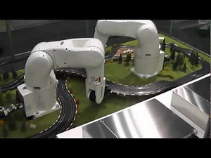 DENSO Robotics - Robots lay out slot-car track