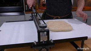 Clay roller used as dough sheeter to make puff pastry