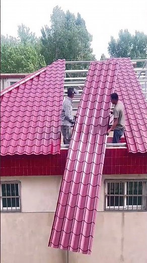 Efficient Roofing Installing Metal Panels on a House