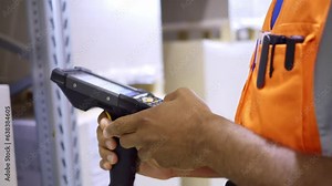 Storehouse worker scanning box barcode, transferring information to warehouse management system close up. Delivery manager using bar code scanner device while doing merchandise inventory