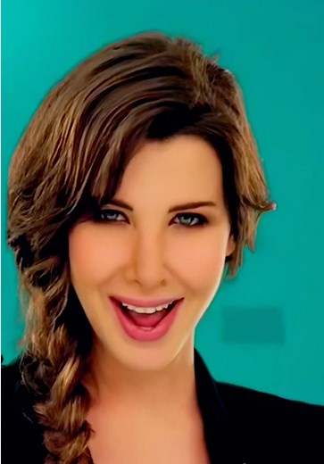 Nancy Ajram waving Wavin' Flag at 2010 World Cup
