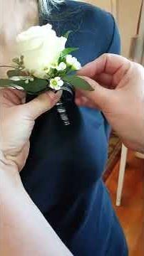How to pin on a boutonniere on a shirt