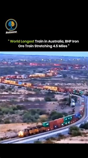 ʙʀᴀɪɴᴠᴇʀꜱᴇ⚡ on Instagram: "This video showcases a massive industrial feat, featuring what is described as the world's longest train in Australia. Stretching an incredible 4.5 miles (approximately 7.3 km) in length, this BHP Iron Ore train is seen snaking through a vast, arid landscape on a single track. The footage emphasizes the sheer scale of the operation, showing hundreds of colorful shipping containers and heavy-duty locomotives working in unison to transport vital resources across the cont