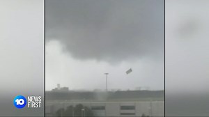 A tornado touched down near Brisbane’s international airport late this morning as stormcells battered Queensland. The system delivered strong winds, intense rain and large hailstones. | 10 News Queensland