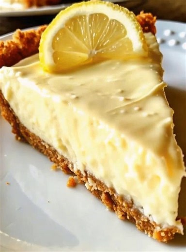 No-Bake Cream Cheese Lemonade Pie 🍋🥧 Ingredients: 1 ½ cups graham cracker crumbs ½ cup unsalted butter, melted 2 tbsp granulated sugar For the filling: 8 oz cream cheese, softened 1 (14 oz) can sweetened condensed milk ½ cup frozen lemonade concentrate, thawed 1 tsp lemon zest 1 cup heavy cream, whipped to stiff peaks For garnish: Lemon slices or zest Whipped cream (optional) Instructions: In a bowl, mix graham cracker crumbs, melted butter, and sugar until well combined. Press firmly into the