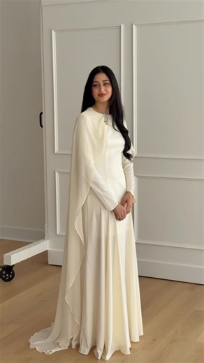 Summer Evenings | Modest Evening Wear on Instagram: "Introducing our latest modest bridal gown— the Embellished Chiffon Cape Gown. This piece is timeless, effortless & feminine, with a cape that flows gracefully, and perfect for bridal occasions. Arriving on Tuesday Jan 20th in Ivory, Plum and Teal 🕊️ mark your calendars 📌"