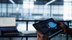 Programmer in data center using AI tech on tablet, testing equipment failover scenarios. Server farm IT specialist uses artificial intelligence on device, ensuring data accessibility, camera B closeup