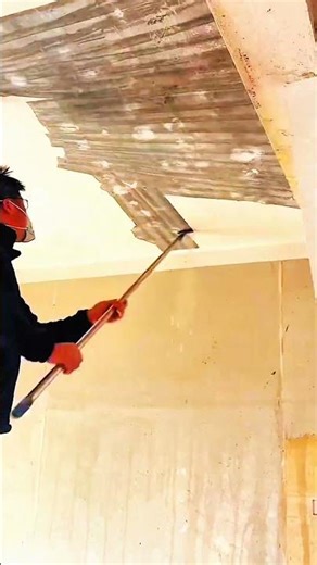 Jackhammer breaks concrete—gloved hands guide rhythm of pound, crack, and reinforced floor yields.