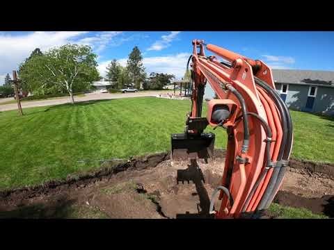 Mini Excavator Digging With a 36" Bucket