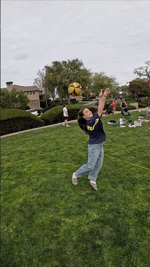 Sunny day volleyball fun with friends playing on grass full energy ☀️