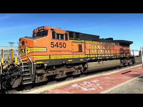 Many rail cars covered with graffiti rapidly passing by