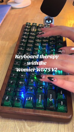 Typing asmr with this beautiful keyboard 💚🤎mo. Real walnut wooden case, Beautiful emerald green transparent keycaps that you have to see in person because the video does not do it justice 🫠, Mint blizzard switches, Gasket mounted, Hot swappable, MDA keycaps, and Tri-mode connectivity , the Womier WD75 V2 is simply stunning and I’m obsessed with it . . . @Womier Keyboard . . . . . . . . . . . #keyboardasmr #typingasmr #gamingkeyboard #keebtok #womier