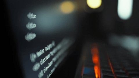 clip-4005753023-developer-observes-ai-driven-code-generation-on-computer