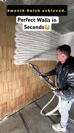 Professional Plastering Machine Applying Smooth White Coating To Walls