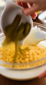 How to make this recipe: Loaded Cornbread Casserole Ingredients Serves 12 3 slices bacon, cooked until crispy and chopped 1/2 can green anaheim chilies 10 ounces of canned corn, drained 2 cups grated cheddar cheese- divided use 1 cup milk 1 cup sour cream 6 tablespoon butter, melted 1 cup cornmeal 1 cup all purpose flour 1 tablespoon baking powder 1 teaspoon salt 2 tablespoon sugar Salt and Pepper- to taste #LoadedCornbreadCasserole #ComfortFood #CasseroleRecipes #CornbreadLovers #FoodieFavorite