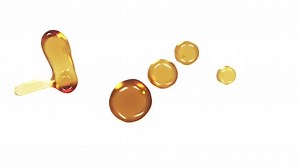 Golden Liquid Drops Splashing and Flowing on White Background