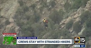 Rescuers spend night with stranded hikers
