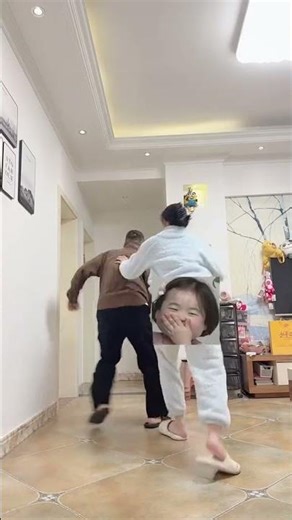 Heartwarming Shadow Dance: A Couple's Playful Moment