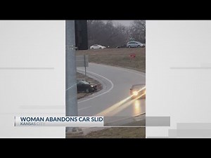 Woman jumps from car sliding on ice