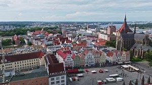 Aerial drone view of The Neue Markt in Rostock , Germany . New market is one of the three former marketplaces of the Hanseatic city. On the east side of the market is the Rostock town hall .