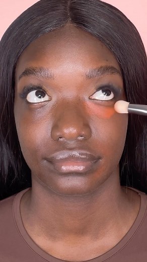 HUDA BEAUTY on Instagram: "#FauxFilter Color Corrector = the easiest way to get a brighter, more even complexion ✨ The gorgeous Khadeejah is using our #FauxFilter Color Corrector in shade Blood Orange. She follows with our #FauxFilter Luminous Matte Foundation in shade Hot Fudge 550R, #FauxFilter Luminous Matte Concealer in shade Butterscotch 7.5G, and our Easy Bake Loose Setting Powder in shade Cinnamon Bun. ✨ Use 1 dot to brighten & 3 to correct for a super bright, snatched undereye! Available