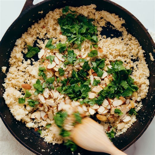 This Mediterranean cauliflower rice recipe is the perfect light side dish! 🙌It's low carb, vegan and gluten free, too. It's kicked up several notches by some of my favorite Mediterranean ingredients. Fresh parsley, lemon, garlic, toasted almonds and red pepper flakes make this cauliflower rice an irresistible side dish.🙋🏻‍♀️✨️ Mediterranean Cauliflower Rice recipe on the blog! https://cookieandkate.com/mediterranean-cauliflower-rice-recipe/ | Cookie and Kate