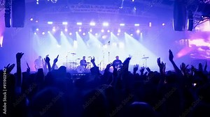 Indie Rock Band delivers a mesmerizing live performance with guitars and drums at a massive open-air concert.AI generatif 4k 60fps Stock Video