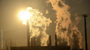 Industrial air pollution from smokestacks. Factory chimney blowing pollution in environment. Toxic smoke from thermal power plant in industrial area. Industrial landscape with contaminated air. Pipes