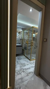 ✨ MODERN LUXURY AT ITS FINEST! ✨ Transform your space with this elegant bathroom design featuring: ✅ Gold-framed glass shower cubicle ✅ Sleek floating vanity with LED-lit mirror ✅ High-end marble finish for walls & floor ✅ Hidden cistern WC for a clean look 💧 A touch of class, a splash of style. 📞 Call us today for your dream bathroom: 0743752908 / 0790298189 #LuxuryBathroom #ModernDesign #ClassicalBomaInteriors #BathroomGoals #InteriorDesignKenya #MarbleBathroom #GoldFinish #BathroomInspo | C