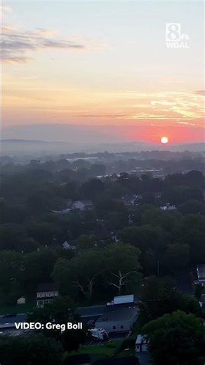 Drone captures Ephrata sunrise: Golden glow over rolling hills and town