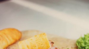 clip-1099322959-waviness-effect-sandwich-french-baguette-cheese-lettuce