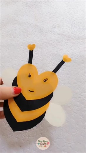 घर घर Craft on Instagram: "In this easy paper craft video, we are making a cute bee art using heart shape paper 🐝✂️. This DIY paper bee craft is simple, fun, and perfect for kids’ creative activities. The cute face and simple design make this craft very attractive and enjoyable to watch. Paper bee crafts are ideal for kids’ activities 🧒, school projects 🏫, art and craft classes 🎨, and simple home decoration ideas 🏠. If you enjoy easy DIY crafts, paper art, cute handmade projects, and creati