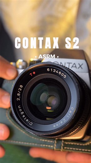 Film Camera Store Viet Nam on Instagram: "The Contax S2 (1992) – a true celebration of 60 years of Contax heritage. Released in October 1992, this fully mechanical 35mm SLR was designed for the purist — those who believe that true photography begins when everything becomes manual. Crafted with titanium top and bottom plates, the S2 requires no battery except for its light meter. Its soul lies in precision and simplicity: manual focus, manual operation, and a fully mechanical shutter capable of s